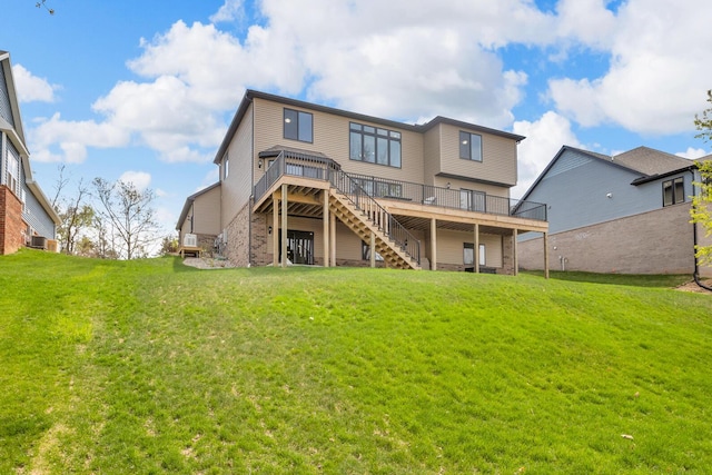 146 Bloomfield Blvd, Brooklyn, MI 49230 - rear view of house featuring a lawn, stairway, and a deck