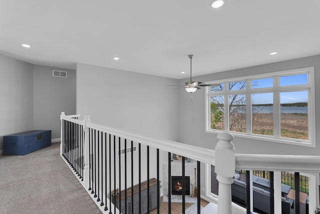 146 Bloomfield Blvd, Brooklyn, MI 49230 - hallway featuring a water view, an upstairs landing, recessed lighting, and visible vents