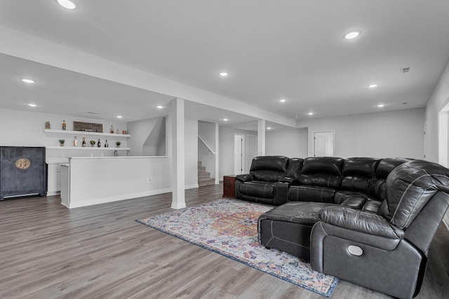 146 Bloomfield Blvd, Brooklyn, MI 49230 - living area featuring bar, stairs, recessed lighting, baseboards, and wood finished floors