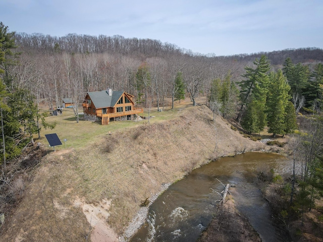 aerial view featuring a wooded view