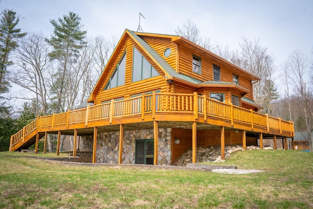 back of property with a yard, log siding, a wooden deck, and stone siding