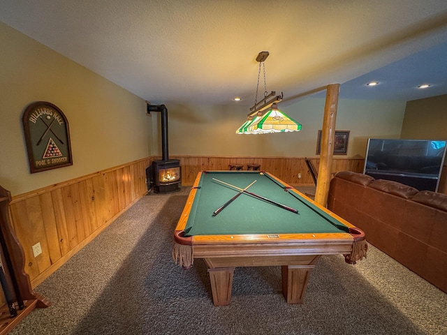 rec room with carpet floors, wooden walls, billiards, and a wainscoted wall