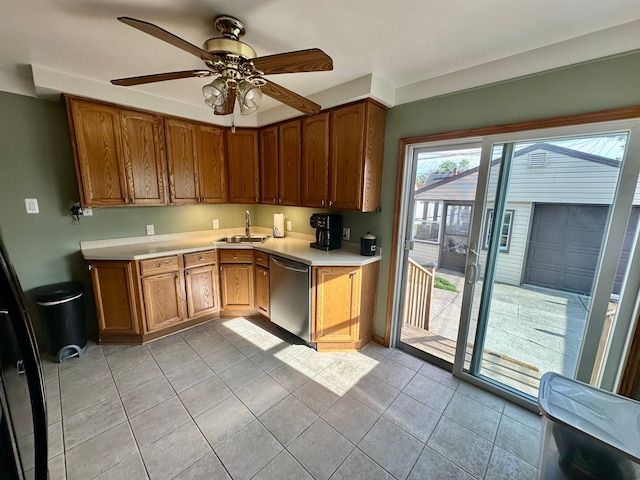 kitchen featuring a ceiling fan, light countertops, a sink, and dishwasher