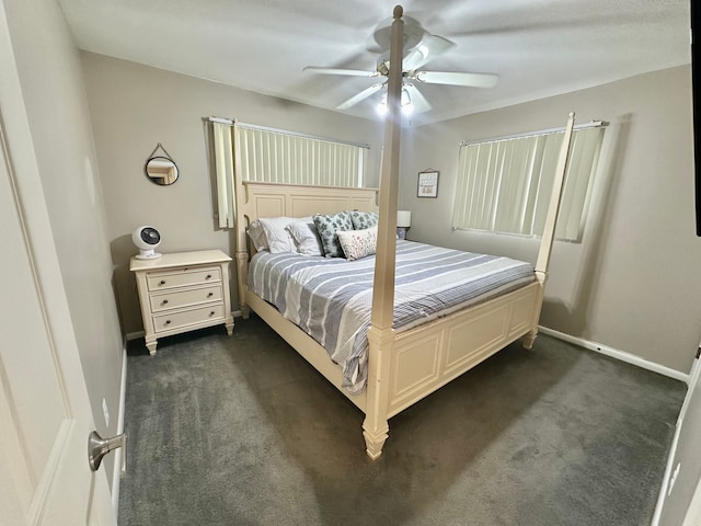 bedroom with ceiling fan, baseboards, and dark carpet
