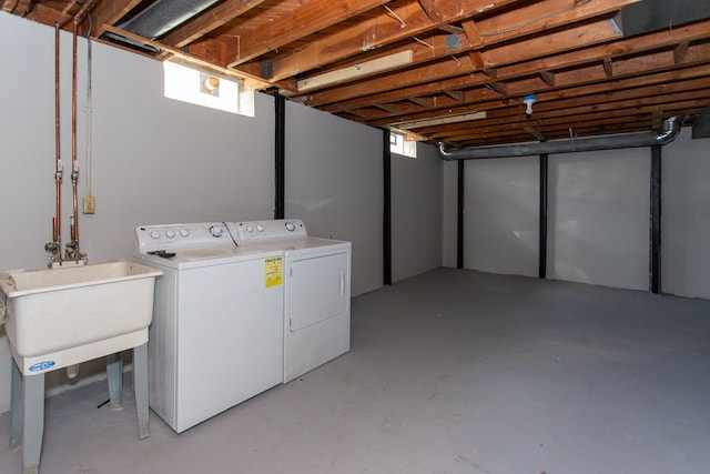 below grade area featuring separate washer and dryer