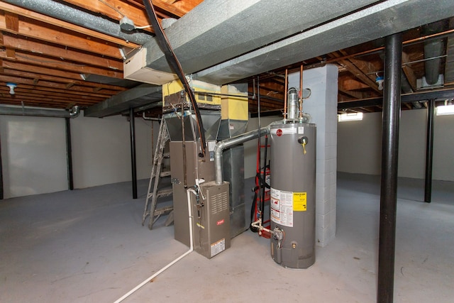 unfinished below grade area with heating unit and gas water heater