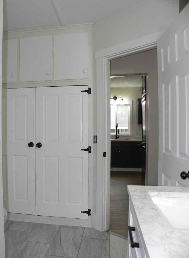 bathroom featuring vanity and toilet