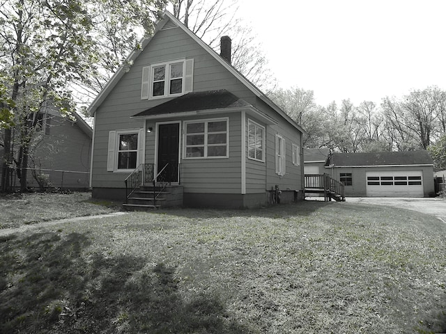 bungalow-style house with fence, an outbuilding, a chimney, and driveway