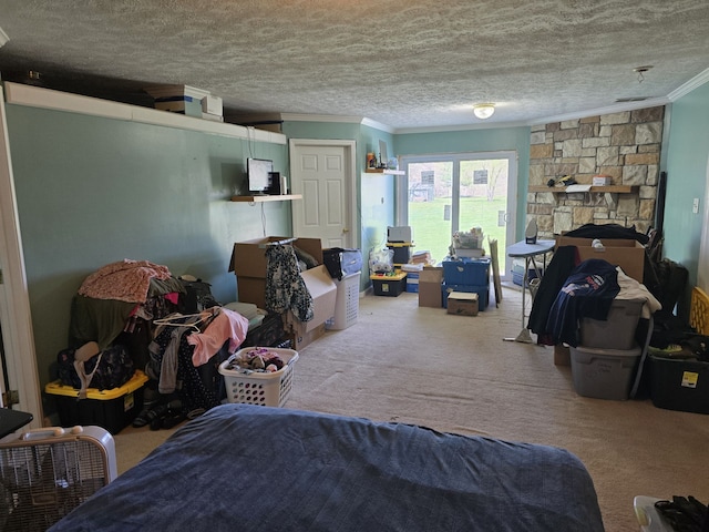 bedroom featuring crown molding, carpet flooring, and a textured ceiling