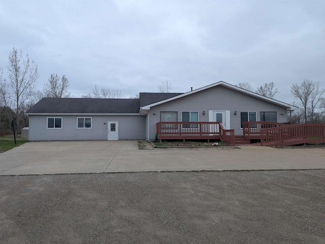 3344 E Huron, Au Gres, MI 48703 - view of front of house featuring driveway and a deck
