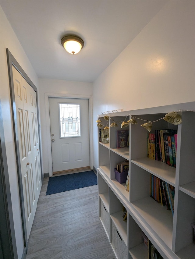 3344 E Huron, Au Gres, MI 48703 - doorway featuring baseboards and wood finished floors