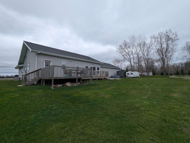 3344 E Huron, Au Gres, MI 48703 - back of property with a deck and a lawn