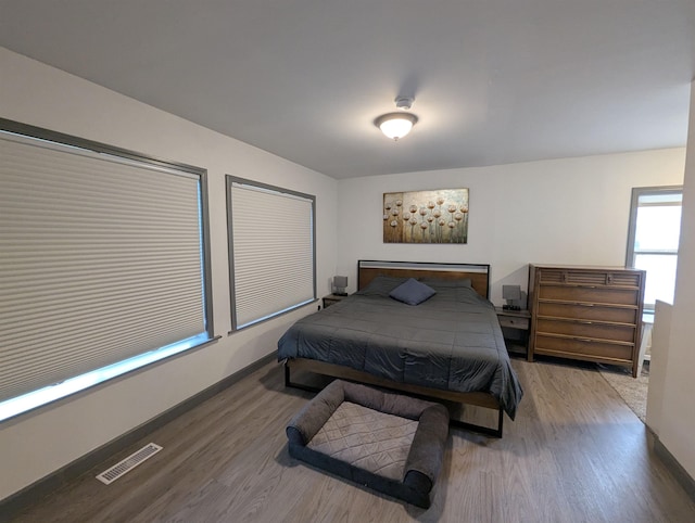 3344 E Huron, Au Gres, MI 48703 - bedroom with visible vents, wood finished floors, and baseboards