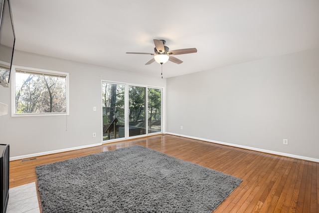 568 Foxboro Sq Unit 59, Brighton, MI 48116 - spare room featuring baseboards, ceiling fan, light wood finished floors, and visible vents