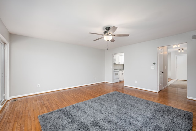 568 Foxboro Sq Unit 59, Brighton, MI 48116 - interior space with baseboards, ceiling fan, hardwood / wood-style flooring, and visible vents