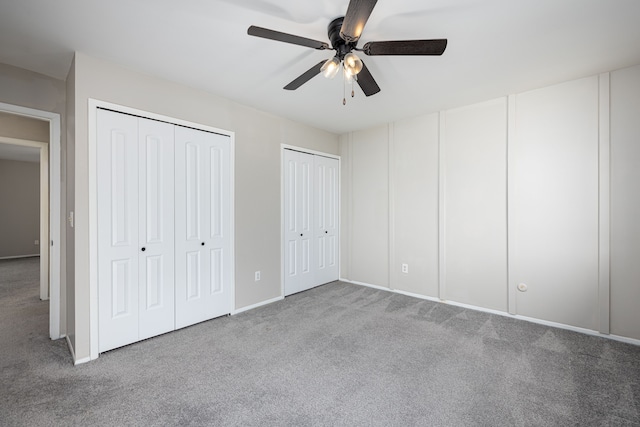 568 Foxboro Sq Unit 59, Brighton, MI 48116 - unfurnished bedroom with carpet floors, a ceiling fan, multiple closets, and baseboards