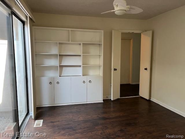 1797 Golf Ridge Dr, Bloomfield Hills, MI 48302 - unfurnished bedroom with wood finished floors and a closet
