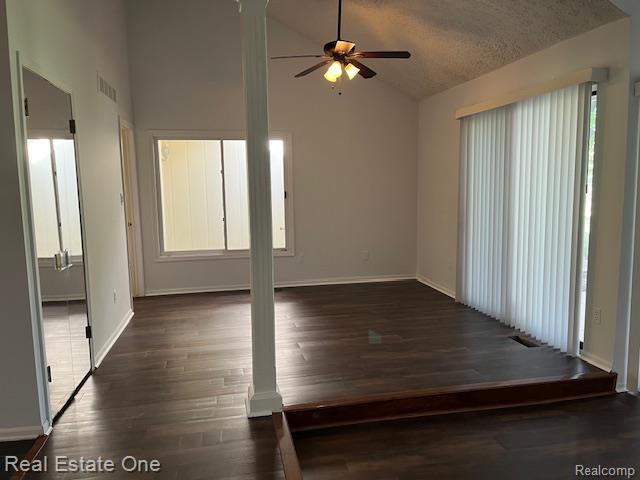 1797 Golf Ridge Dr, Bloomfield Hills, MI 48302 - spare room with a ceiling fan, decorative columns, wood finished floors, healthy amount of natural light, and a textured ceiling