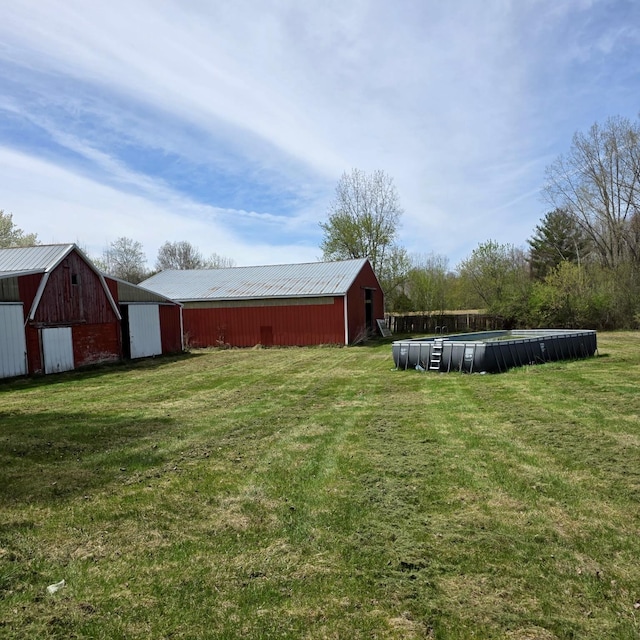4910 W Saginaw, Vassar, MI 48768 - view of yard featuring an outdoor structure and an outbuilding
