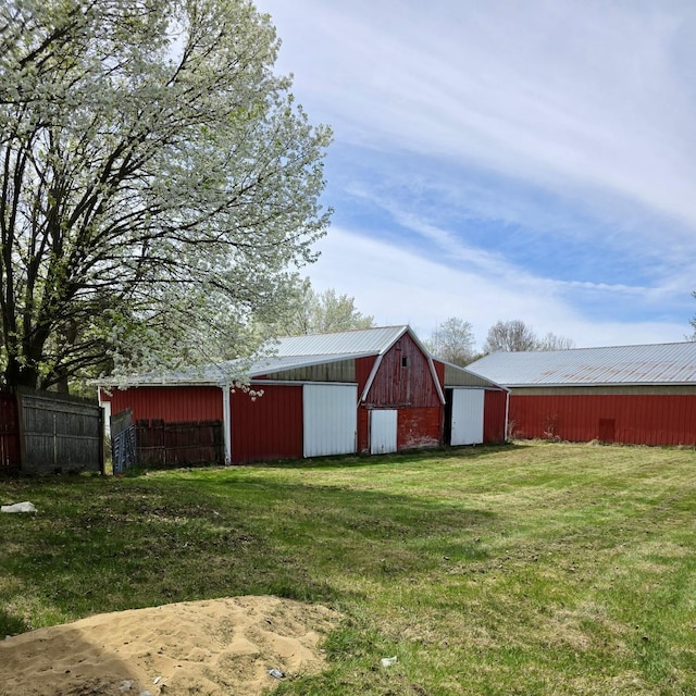 4910 W Saginaw, Vassar, MI 48768 - view of pole building featuring a yard and fence