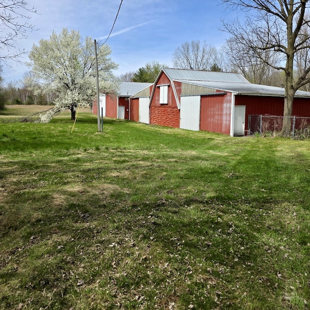4910 W Saginaw, Vassar, MI 48768 - view of yard with a garage and an outbuilding