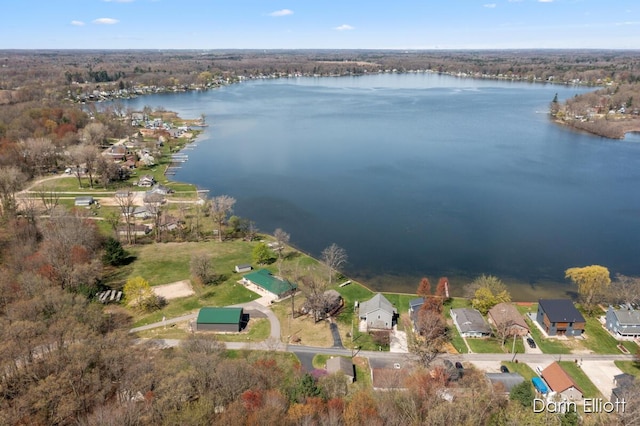 drone / aerial view with a water view and a residential view