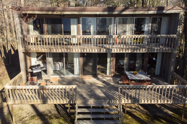rear view of property with a deck