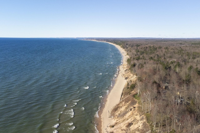 bird's eye view featuring a water view and a view of the beach