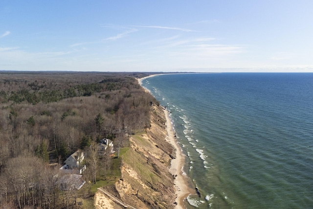 drone / aerial view featuring a water view and a view of the beach