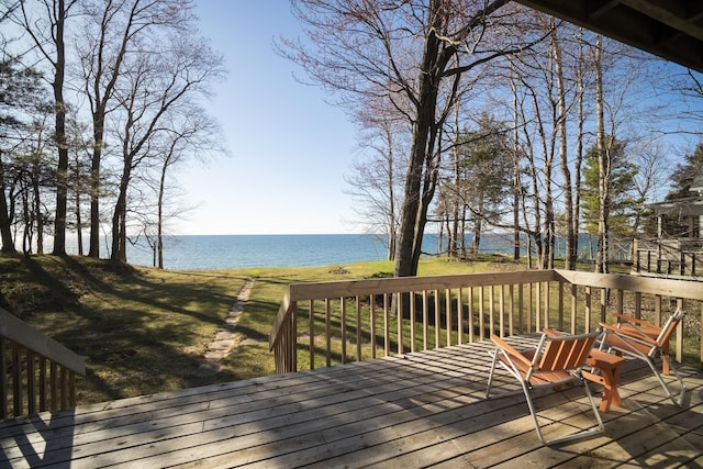 wooden deck featuring a water view