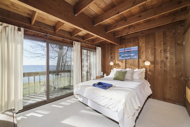bedroom featuring wood ceiling, access to exterior, beamed ceiling, wooden walls, and a water view