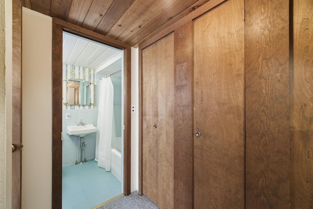hallway featuring wood ceiling