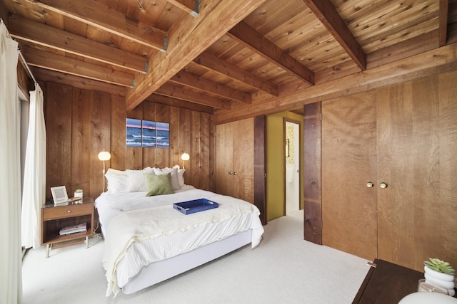 bedroom featuring carpet floors, wooden walls, wooden ceiling, and beamed ceiling