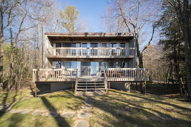 back of house with a yard and a wooden deck