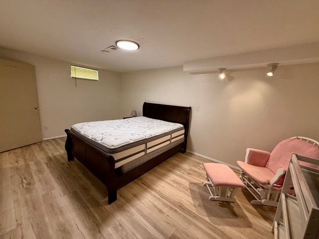 bedroom with light wood-style floors