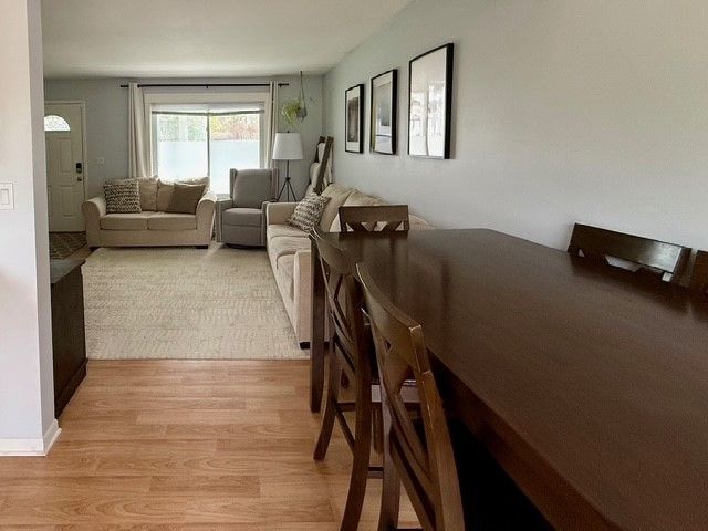 dining space with light wood finished floors