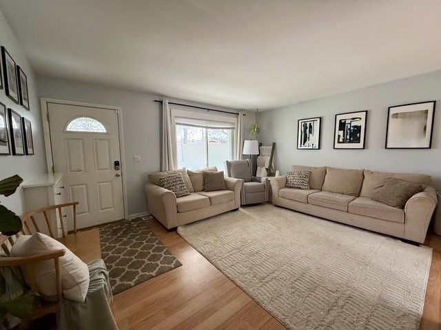 living area featuring plenty of natural light and wood finished floors