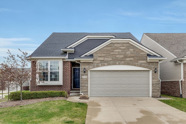 2774 Polson St, Ann Arbor, MI 48105 - view of front of property featuring a garage, a shingled roof, stone siding, and concrete driveway