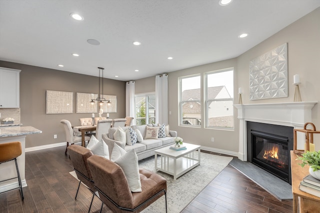 2774 Polson St, Ann Arbor, MI 48105 - living area with dark wood finished floors, baseboards, recessed lighting, and a fireplace with flush hearth