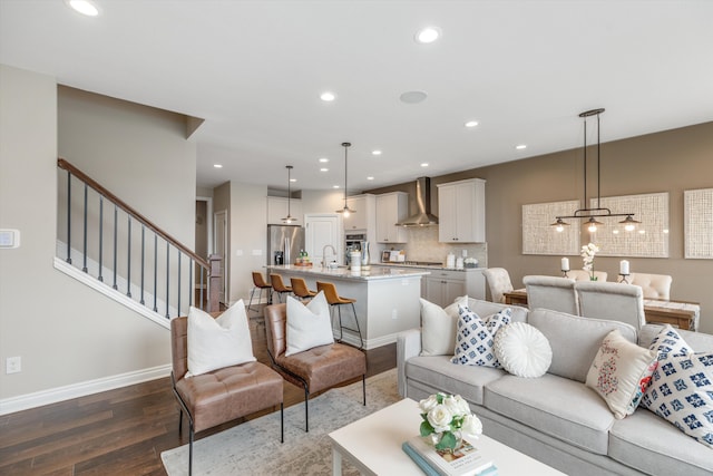 2774 Polson St, Ann Arbor, MI 48105 - living area featuring recessed lighting, baseboards, stairs, and wood finished floors