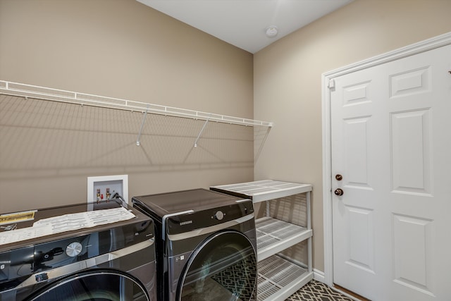2774 Polson St, Ann Arbor, MI 48105 - laundry room featuring laundry area, baseboards, and washing machine and dryer
