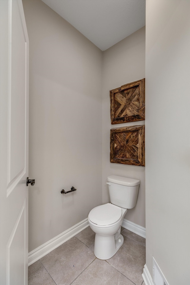 2774 Polson St, Ann Arbor, MI 48105 - bathroom featuring toilet, baseboards, visible vents, and tile patterned floors