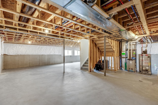 2774 Polson St, Ann Arbor, MI 48105 - below grade area featuring heating unit, gas water heater, and stairway