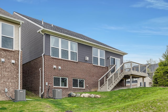 2774 Polson St, Ann Arbor, MI 48105 - rear view of house with central AC unit, a yard, and a deck