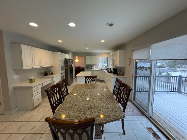 dining space featuring light tile patterned flooring, visible vents, and recessed lighting