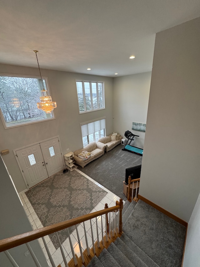 stairs featuring baseboards, carpet flooring, a chandelier, and recessed lighting