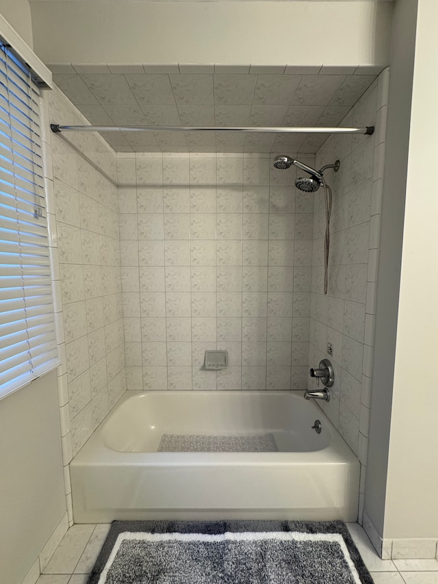 full bath with baseboards, shower / bathing tub combination, and tile patterned flooring
