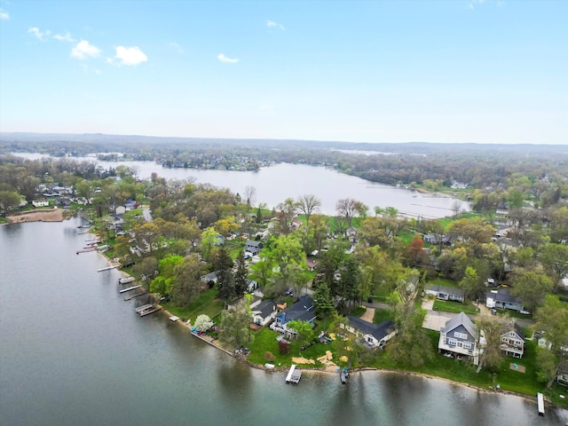 bird's eye view featuring a water view and a residential view