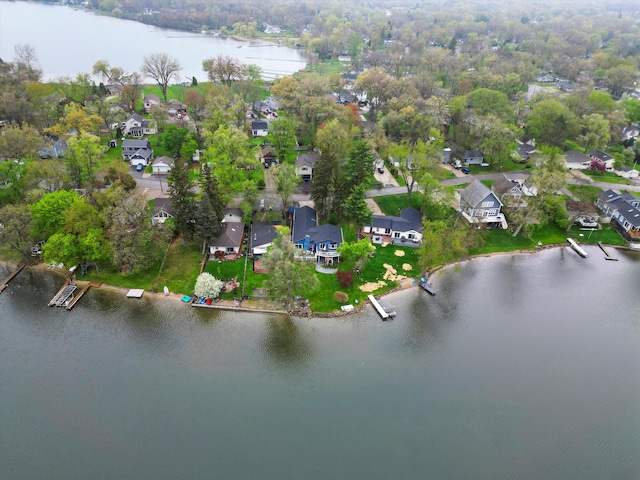 drone / aerial view with a residential view and a water view