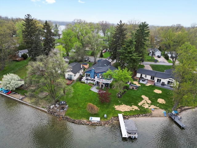 birds eye view of property with a water view and a residential view